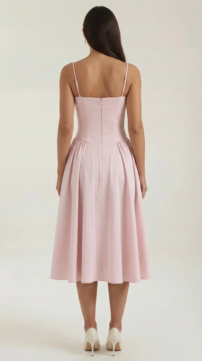 Back view of women's pink corset fit and flare midi dress with flattering silhouette and midi-length skirt by ILYNORA