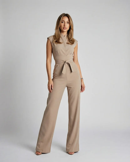 Beige sleeveless jumpsuit for women by Ilynora, front view with defined waist and wide-leg fit