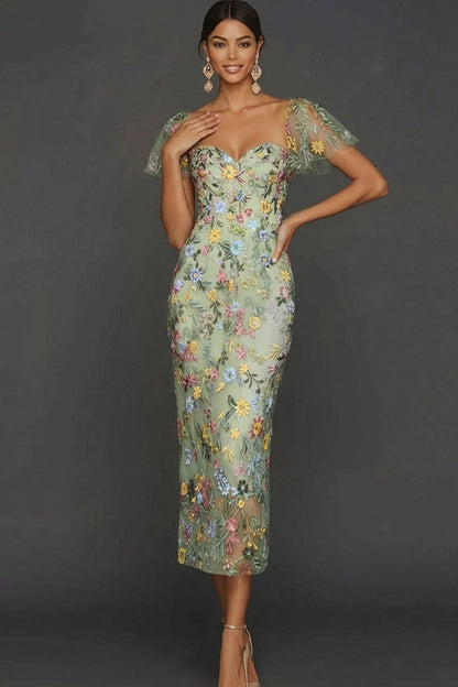 ILYNORA green floral embroidered tulle midi dress, model wearing dress from the front