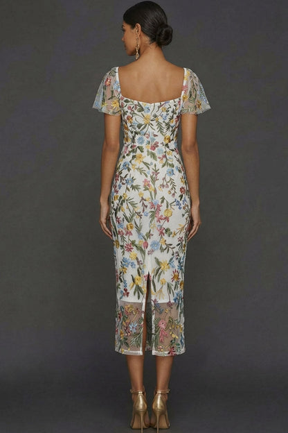 ILYNORA white floral embroidered tulle midi dress, back view of sheath silhouette
