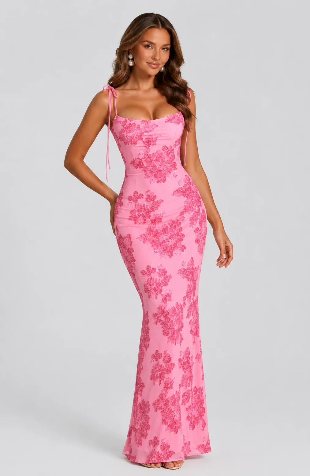 Women's pink floral tie strap maxi dress with embroidered floral pattern, fitted silhouette and elegant floor length design by ILYNORA