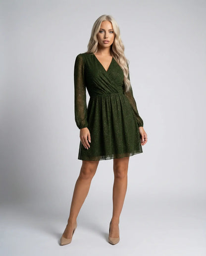Dark green shimmer mini dress by Ilynora with sheer sleeves, front view with flattering silhouette