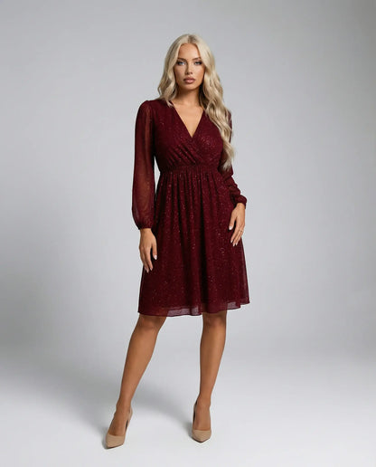 Red shimmer mini dress by Ilynora with sheer sleeves, front view with defined waist and soft movement
