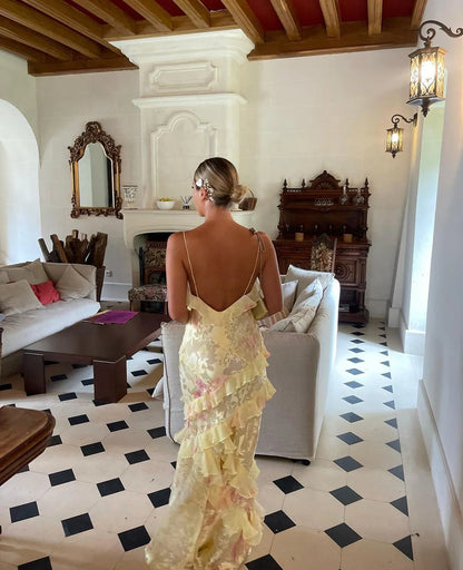 ILYNORA yellow floral ruffle maxi dress with open back, styled for weddings, holidays and summer occasions